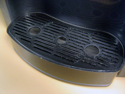 The clean drip tray on the water cooler at work